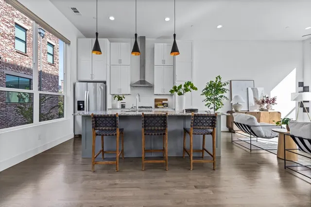 a dining room with furniture window and wooden floor