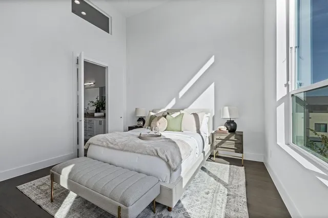 a room with a bed and a window