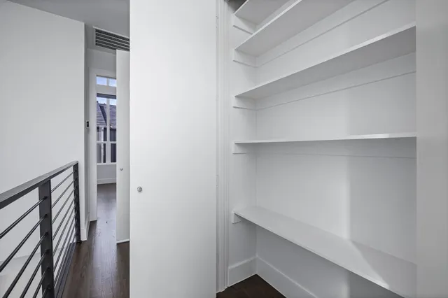 a view of an empty walk in closet