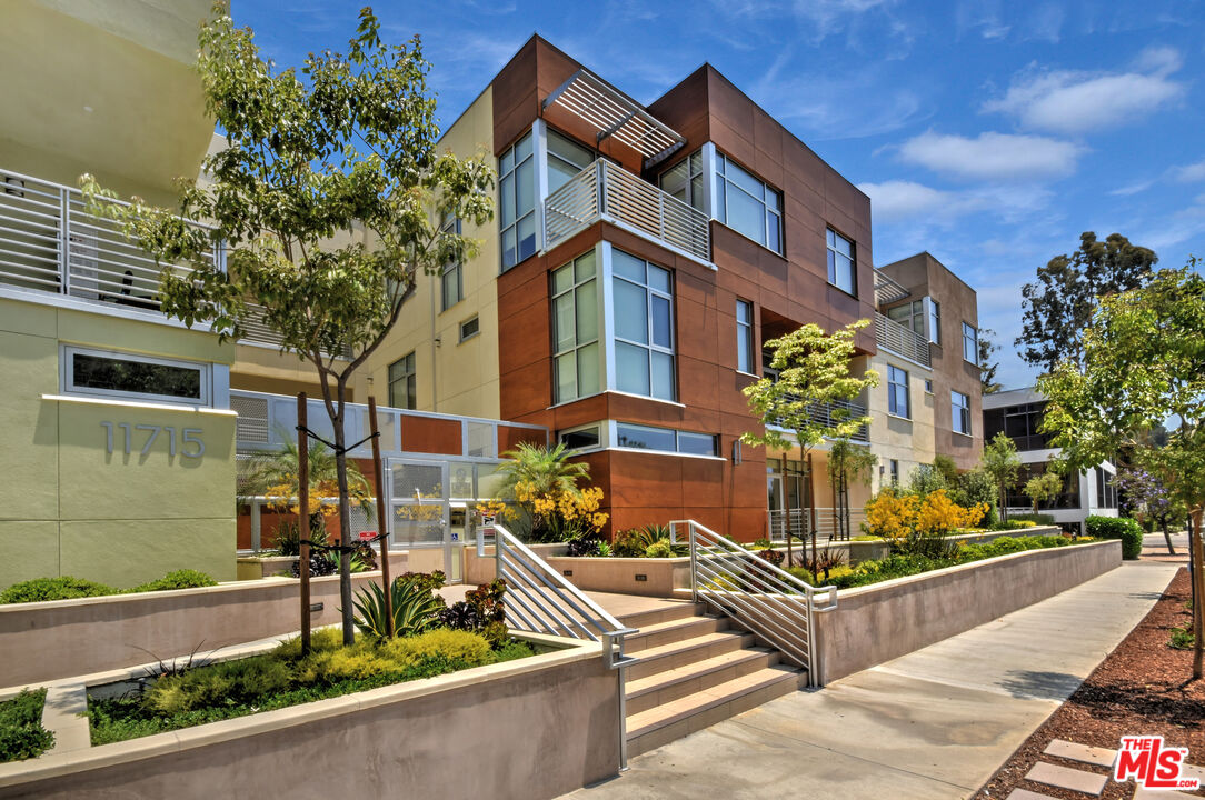 11715 Bellagio Road, Unit 305 Los Angeles, CA 90049 - Photo 1 of 25 a front view of a house with street
