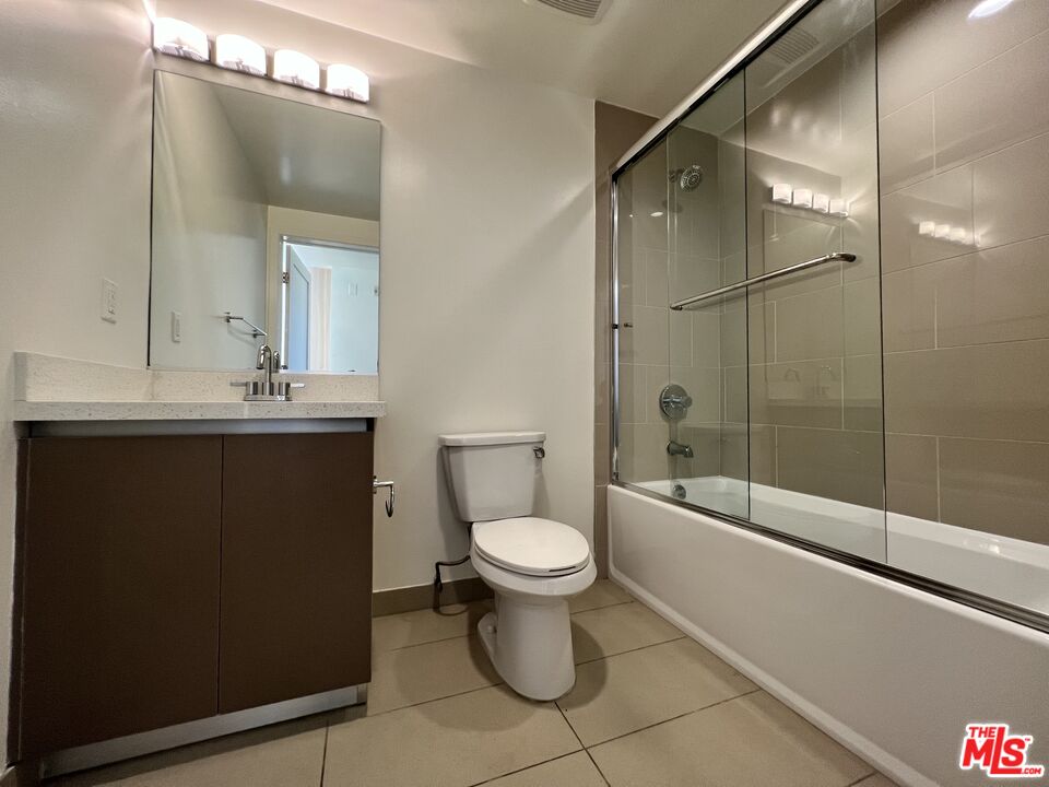 11715 Bellagio Road, Unit 305 Los Angeles, CA 90049 - Photo 14 of 25 a bathroom with a sink toilet and shower