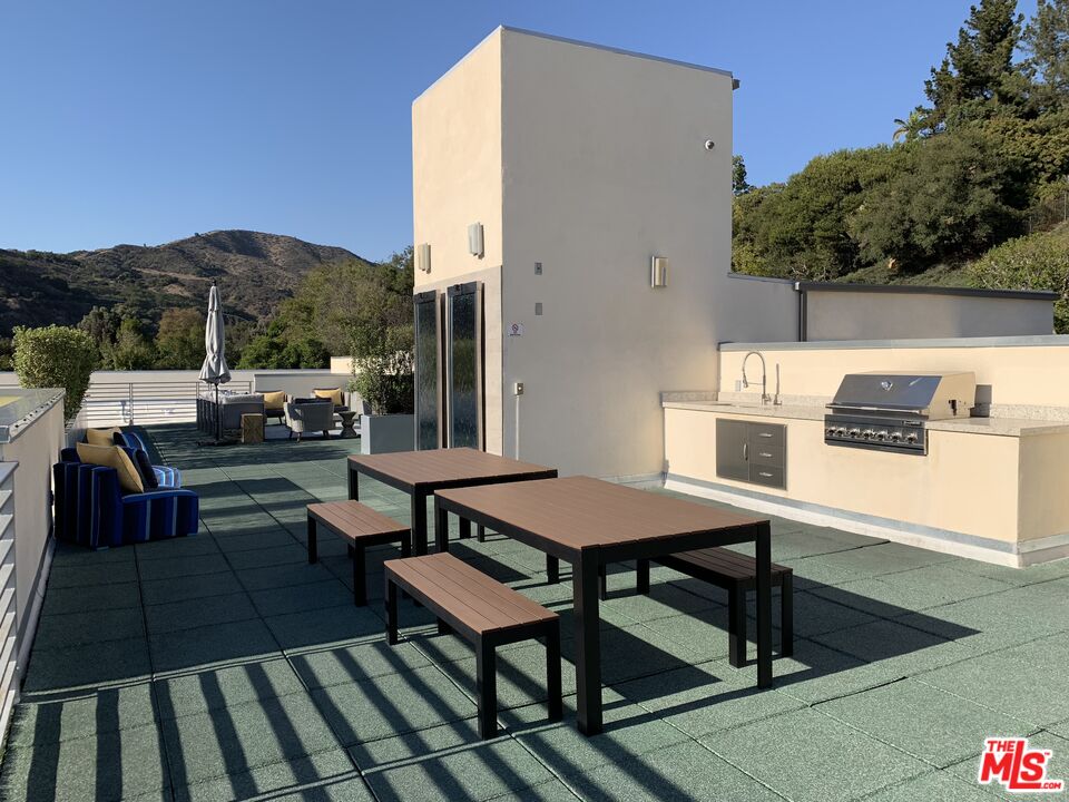 11715 Bellagio Road, Unit 305 Los Angeles, CA 90049 - Photo 20 of 25 a view of a terrace with seating area