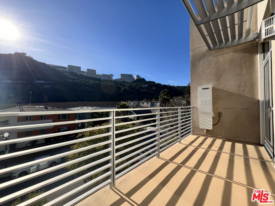 11715 Bellagio Road, Unit 305 Los Angeles, CA 90049 - Photo 7 of 25 a view of outdoor space with deck and city view