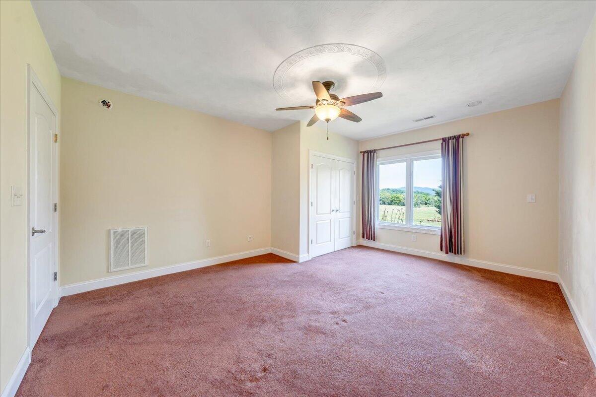 625 Frontier Way Fincastle, VA 24090 - Photo 65 of 105 a view of a livingroom with a ceiling fan and window