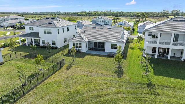 an aerial view of a houses with outdoor space