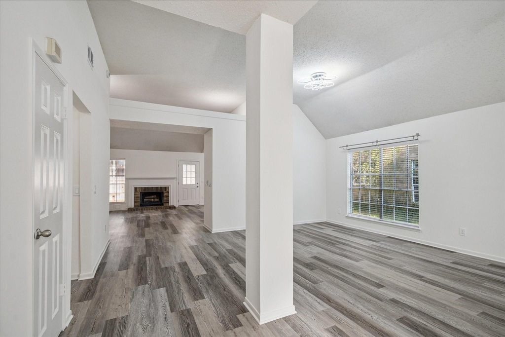 143 West Village Knoll Circle Spring, TX 77381 - Photo 4 of 27 Another view of the expansive living area highlights the modern flooring and neutral finishes that complement any décor style. With its bright, airy feel and easy flow, this space is designed for both function and comfort.