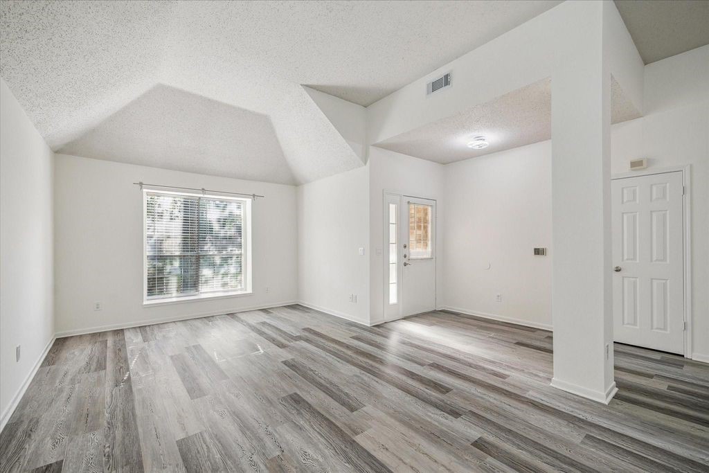 143 West Village Knoll Circle Spring, TX 77381 - Photo 8 of 27 This space off the kitchen boasts a charming fireplace that could make a great dining space of dean area.