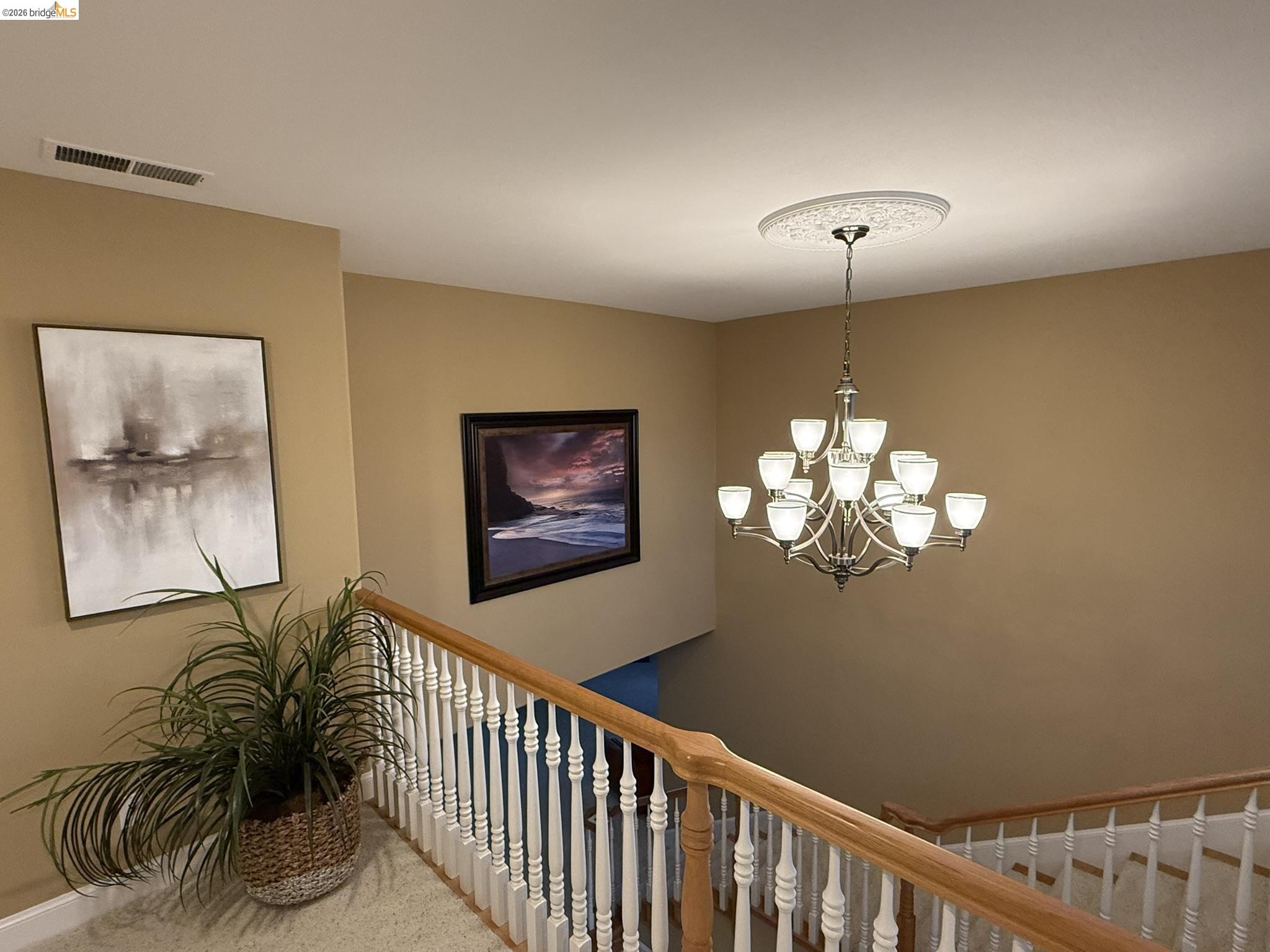 91 Shell Place Discovery Bay, CA 94505 - Photo 27 of 39 a view of a hallway with paintings on the wall