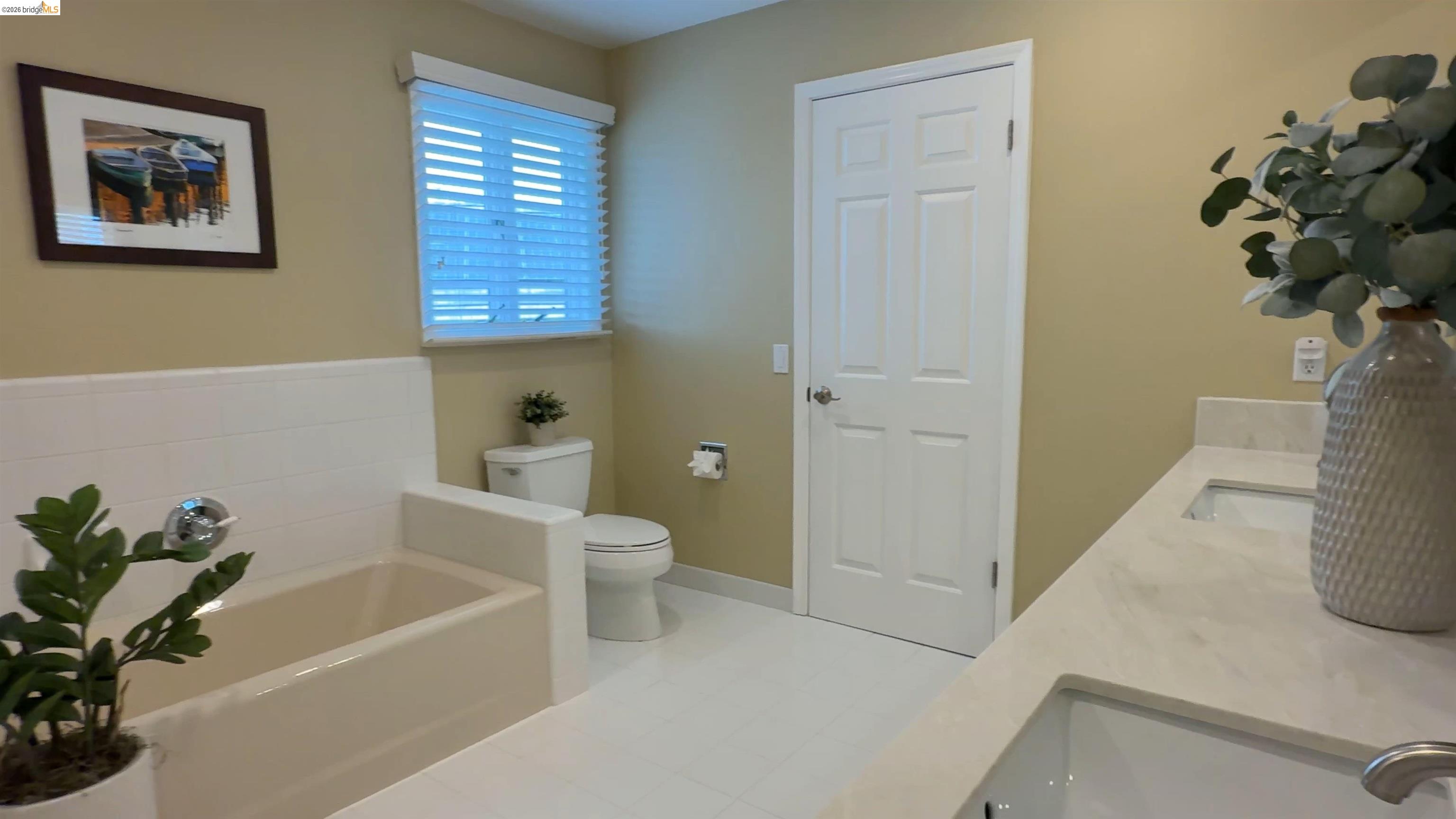 91 Shell Place Discovery Bay, CA 94505 - Photo 29 of 39 a white bath tub sitting next to a white toilet