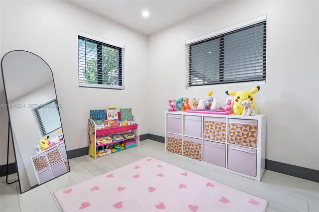 a bedroom with furniture and a wooden floor