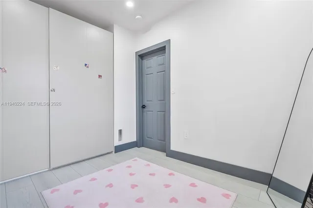 a view of hallway with a small space