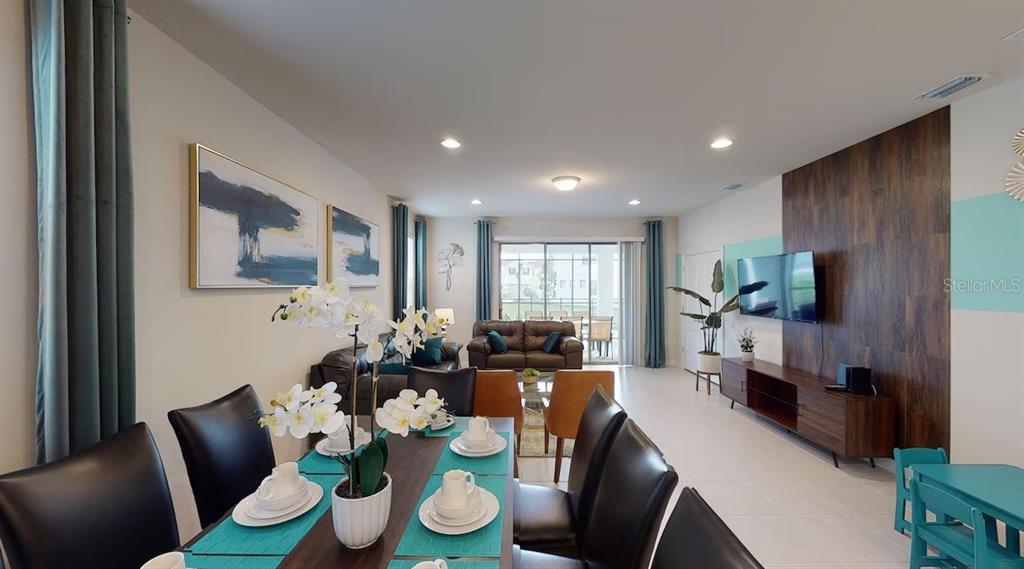 2479 Dubai Street Kissimmee, FL 34747 - Photo 17 of 70 a living room with furniture kitchen view and a window