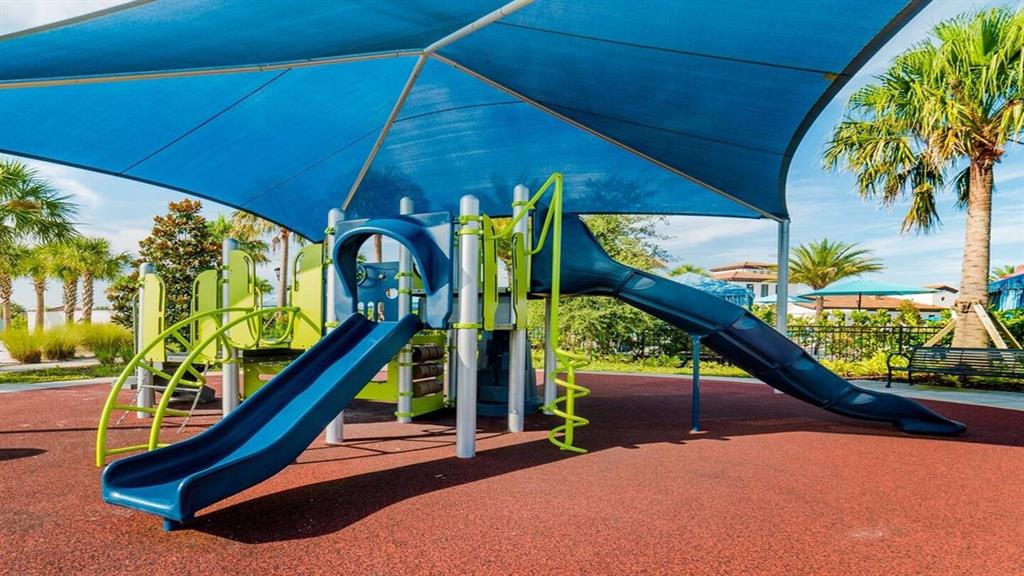 2479 Dubai Street Kissimmee, FL 34747 - Photo 45 of 70 a view of a swimming pool with a patio and a garden