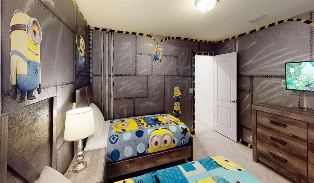 2479 Dubai Street Kissimmee, FL 34747 - Photo 5 of 70 a bedroom with a bed and a dresser