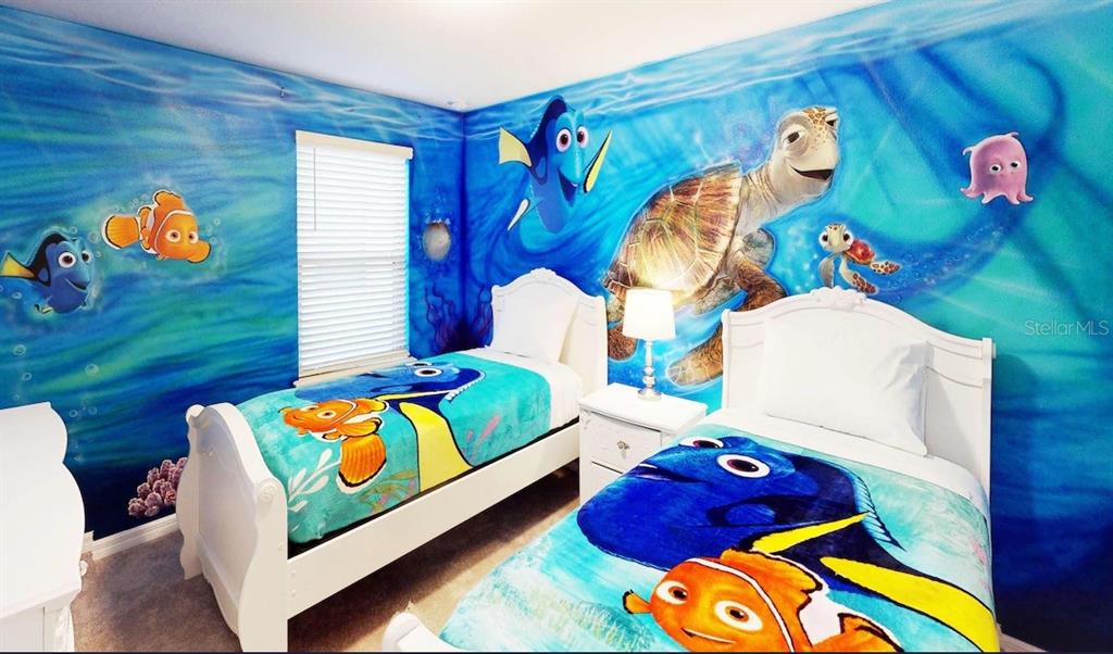 2479 Dubai Street Kissimmee, FL 34747 - Photo 6 of 70 a bedroom with a bed and window