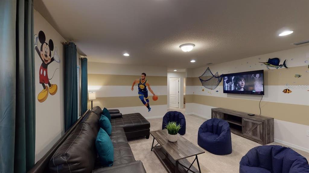 2479 Dubai Street Kissimmee, FL 34747 - Photo 9 of 70 a living room with furniture and a flat screen tv