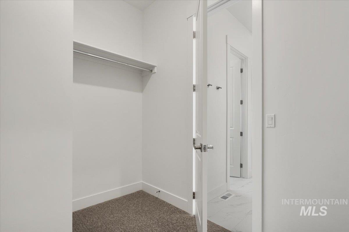 929 North Falling Water Way Eagle, ID 83616 - Photo 35 of 43 Spacious closet featuring carpet