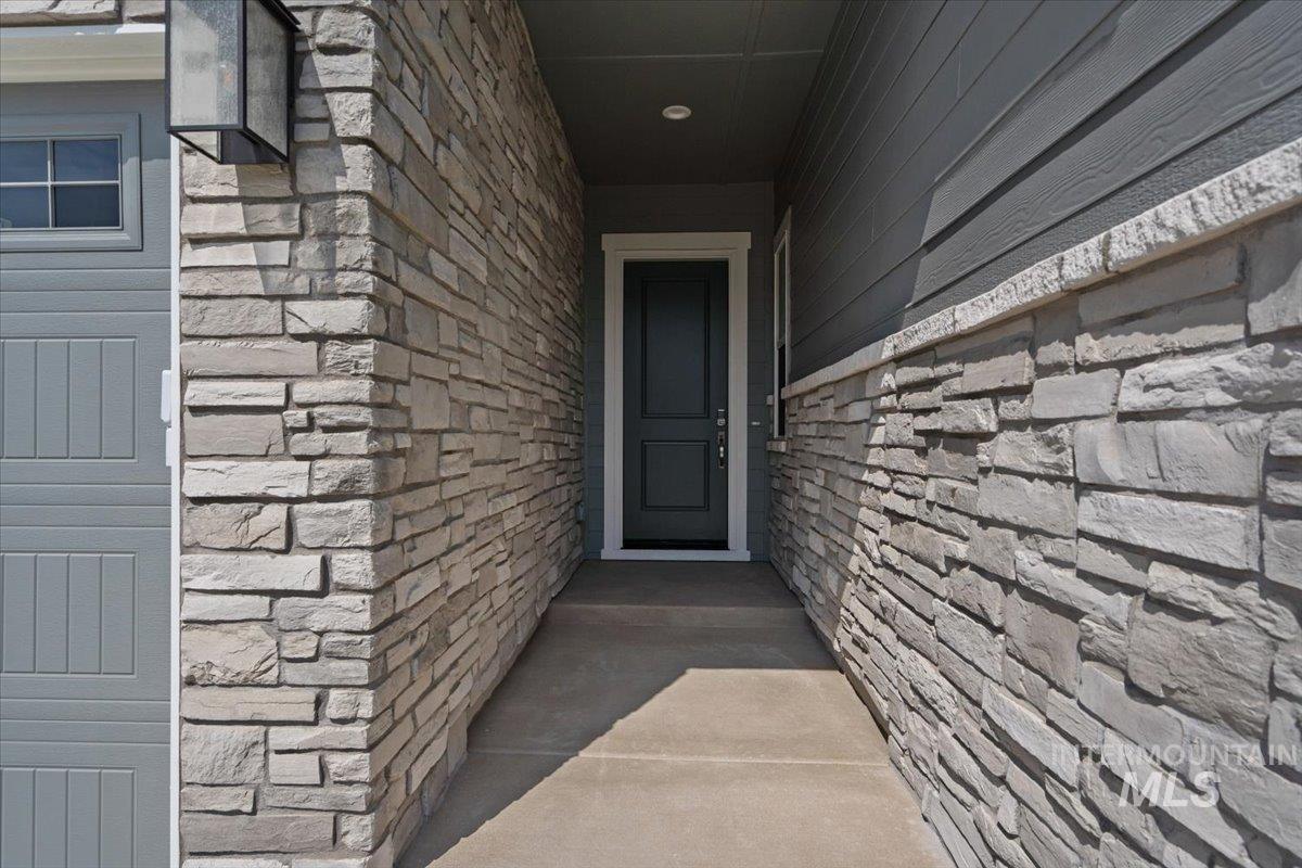 929 North Falling Water Way Eagle, ID 83616 - Photo 4 of 43 Entrance to property with stone siding