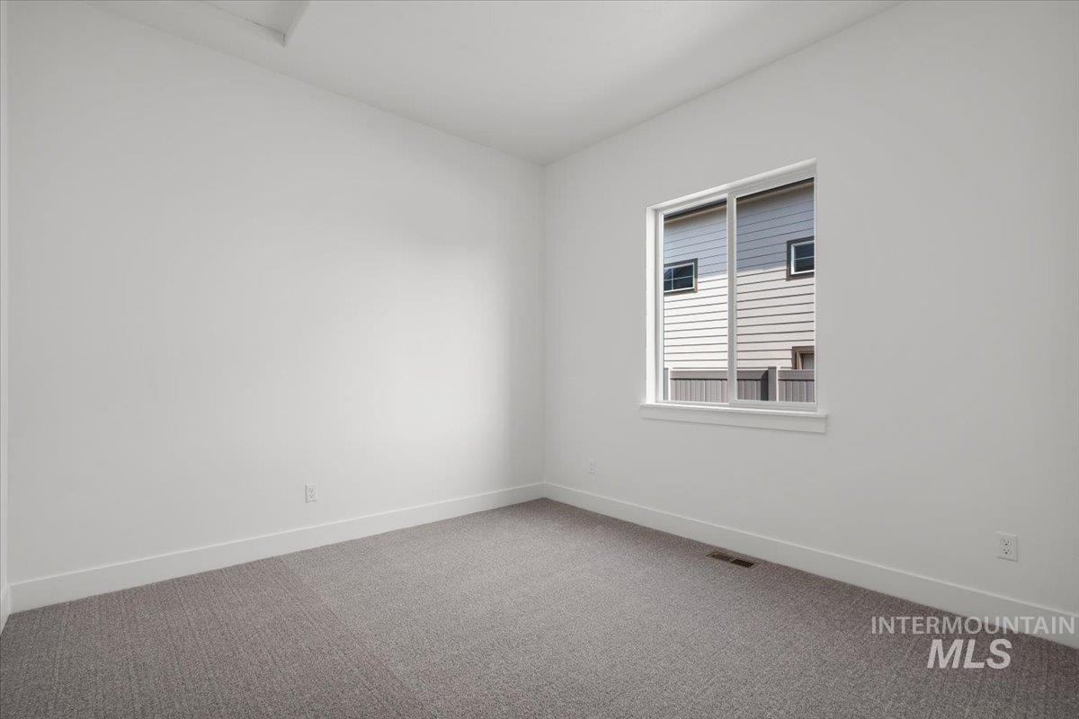 929 North Falling Water Way Eagle, ID 83616 - Photo 7 of 43 Empty room with carpet and baseboards