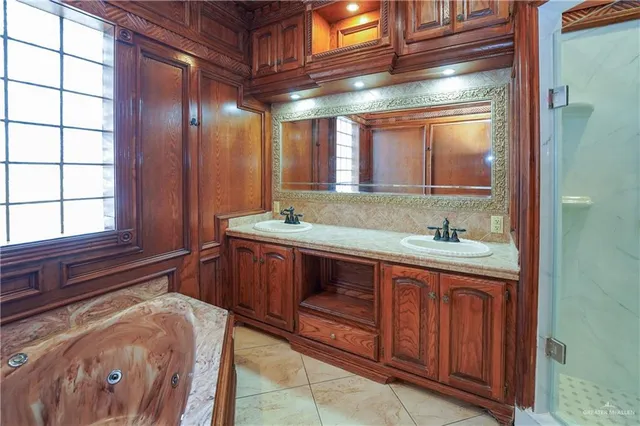 a bathroom with a sink and a large mirror