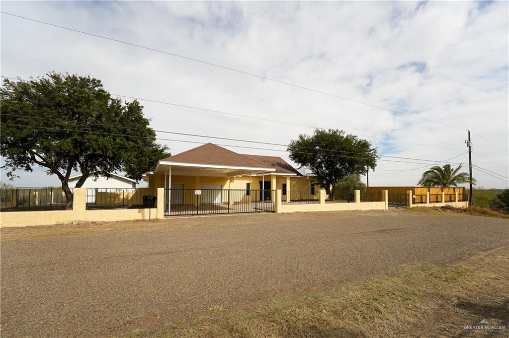 3178 El Campo Road Rio Grande City, TX 78582 - Photo 2 of 40 a front view of a house with a yard and garage