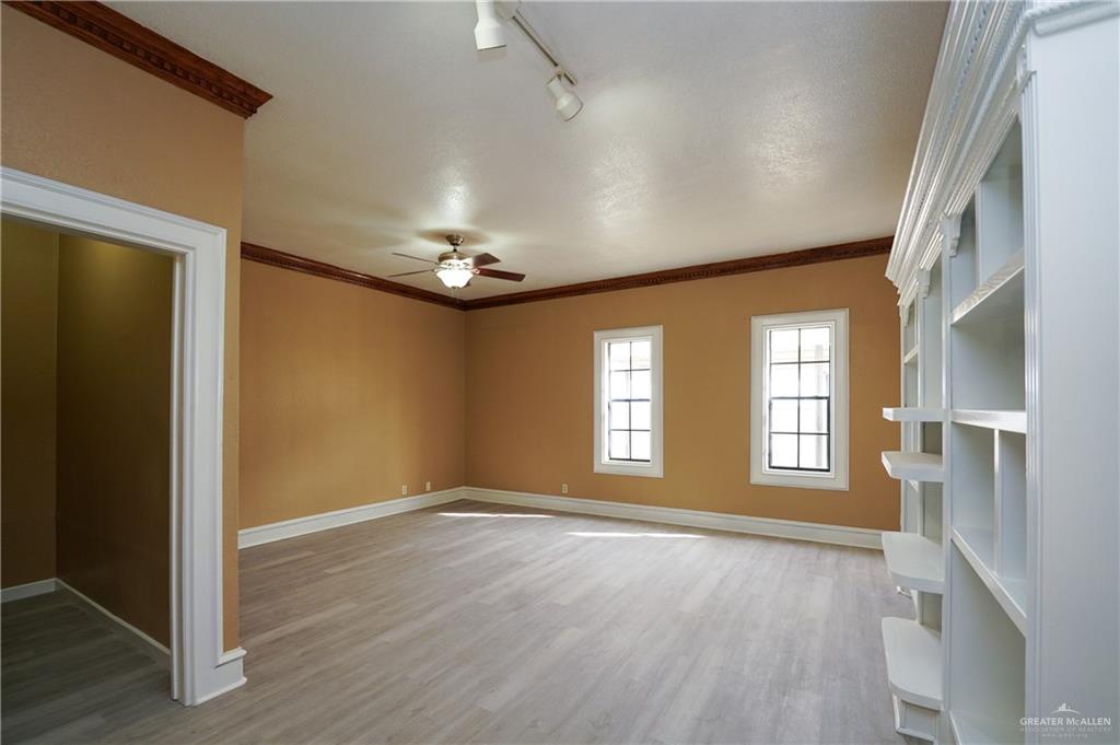 3178 El Campo Road Rio Grande City, TX 78582 - Photo 24 of 40 an empty room with wooden floor and windows