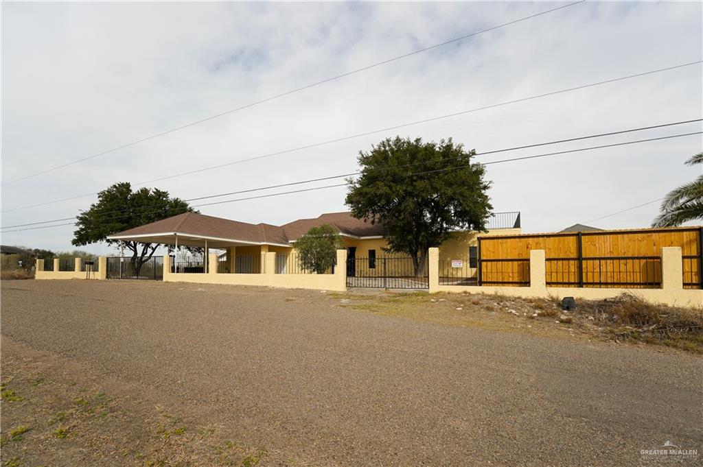 3178 El Campo Road Rio Grande City, TX 78582 - Photo 3 of 40 a front view of a house with a yard and garage