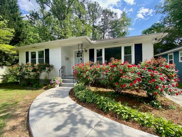 front view of a house with a yard