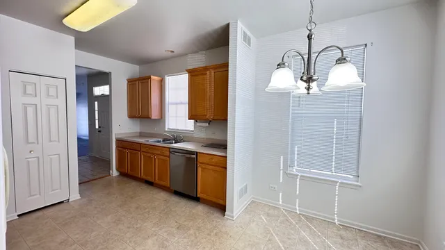 a large kitchen with a window