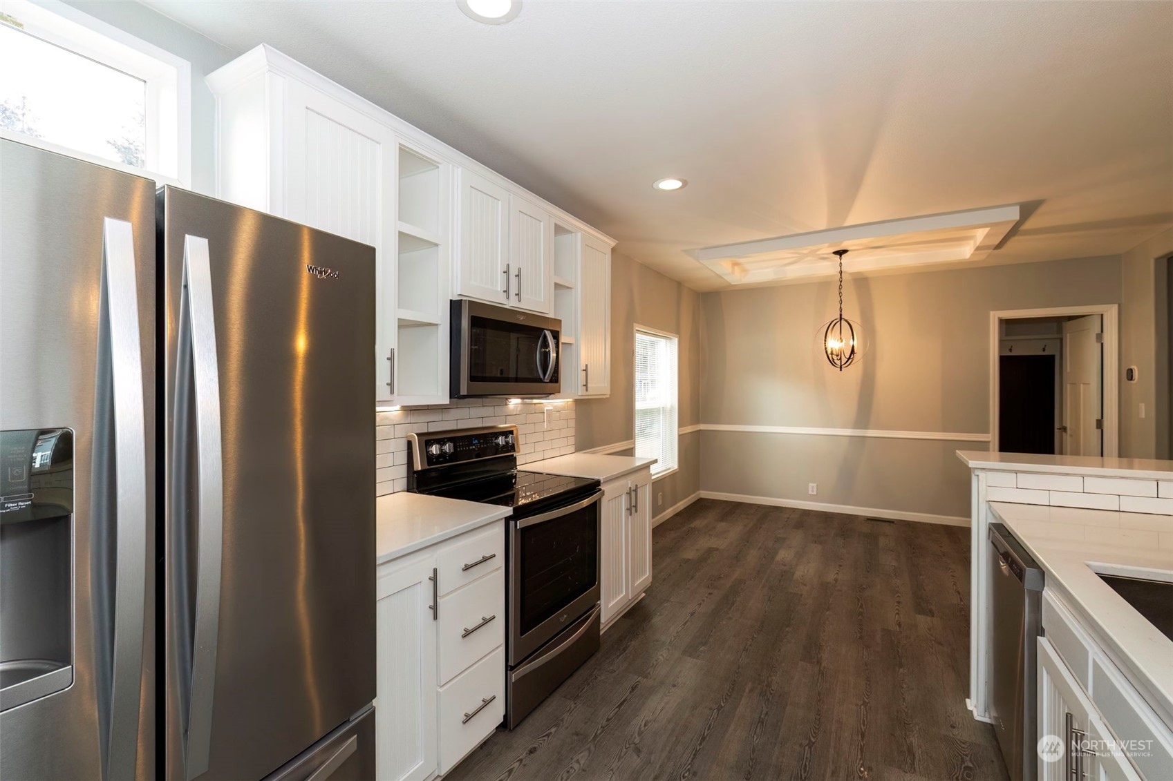 17340 Sargent Road Southwest, Unit 24 Rochester, WA 98579 - Photo 11 of 26 a kitchen with stainless steel appliances a refrigerator sink and microwave