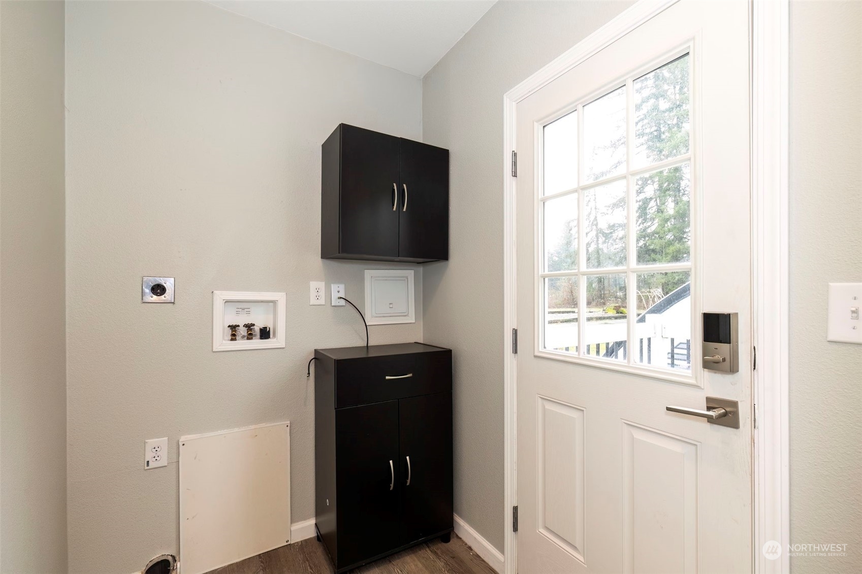 17340 Sargent Road Southwest, Unit 24 Rochester, WA 98579 - Photo 22 of 26 a kitchen with a sink and a flat screen tv