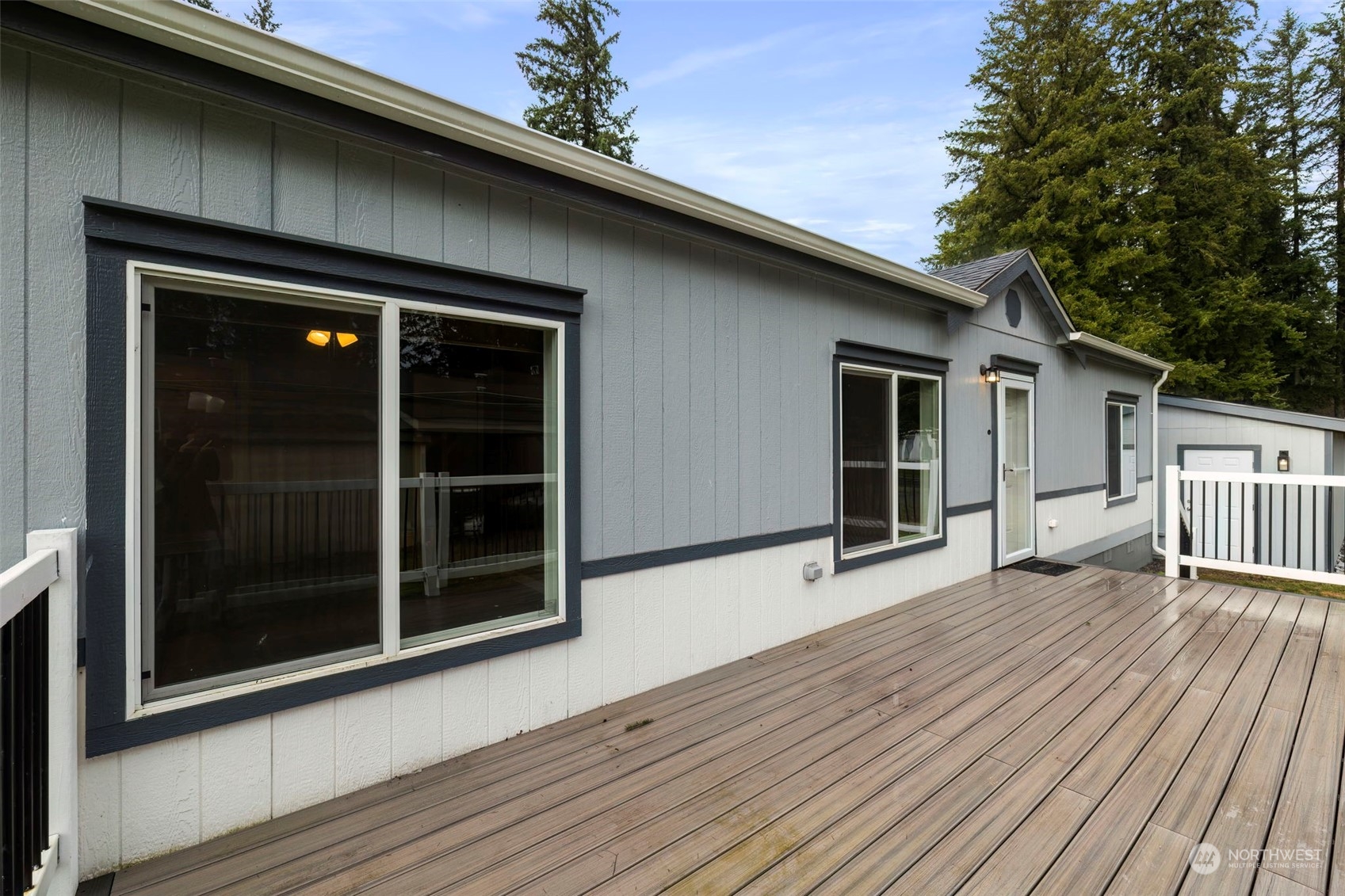 17340 Sargent Road Southwest, Unit 24 Rochester, WA 98579 - Photo 4 of 26 a view of a house with wooden floor and a window