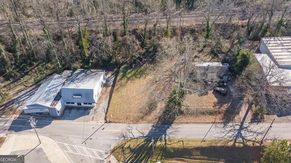 an aerial view of residential house with outdoor space and seating