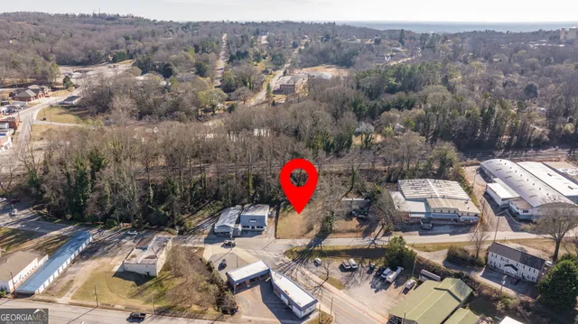 an aerial view of a house with outdoor space