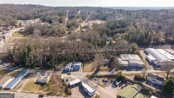 an aerial view of a houses with a swimming pool