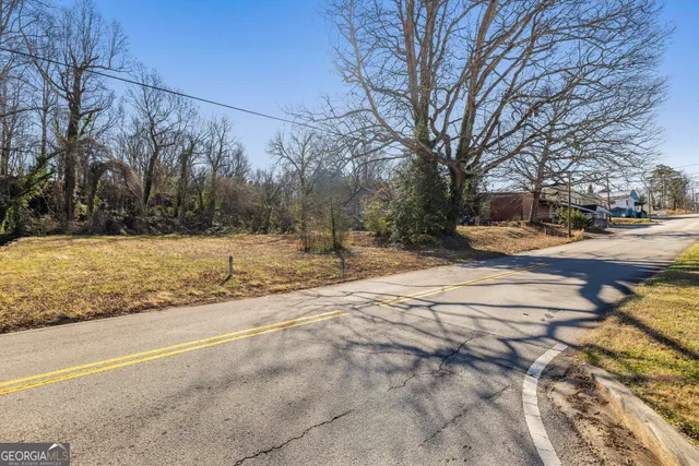 a view of a yard with trees