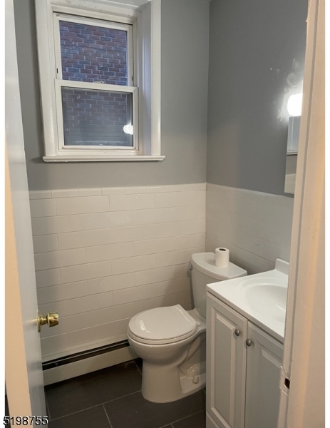 357 Franklin Street, Unit 8 Bloomfield, NJ 07003 - Photo 3 of 5 a white toilet sitting next to a bathroom sink