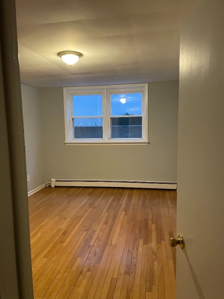 357 Franklin Street, Unit 8 Bloomfield, NJ 07003 - Photo 5 of 5 a view of an empty room and wooden floor