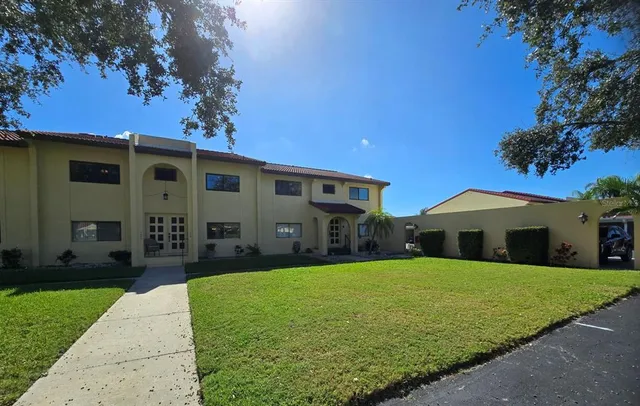 front view of a house with a yard