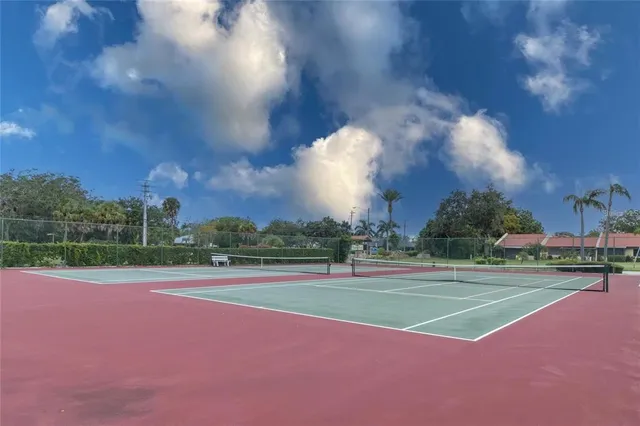 a view of an outdoor space and tennis court