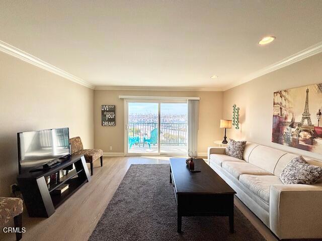 3101 Peninsula Road, Unit 217 Oxnard, CA 93035 - Photo 13 of 17 a living room with furniture flat screen tv and a large window