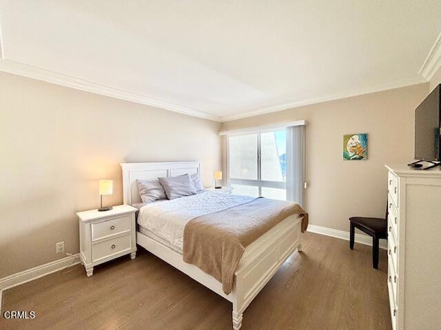 3101 Peninsula Road, Unit 217 Oxnard, CA 93035 - Photo 16 of 17 a bedroom with a bed and a chair