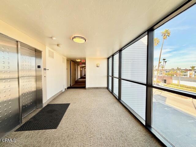 3101 Peninsula Road, Unit 217 Oxnard, CA 93035 - Photo 4 of 17 a view of a hallway with windows