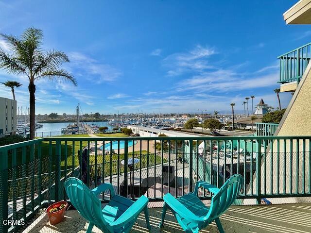 3101 Peninsula Road, Unit 217 Oxnard, CA 93035 - Photo 7 of 17 a view of a balcony with chair and wooden floor