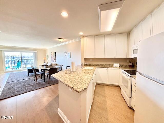 3101 Peninsula Road, Unit 217 Oxnard, CA 93035 - Photo 8 of 17 a kitchen with counter top space and appliances