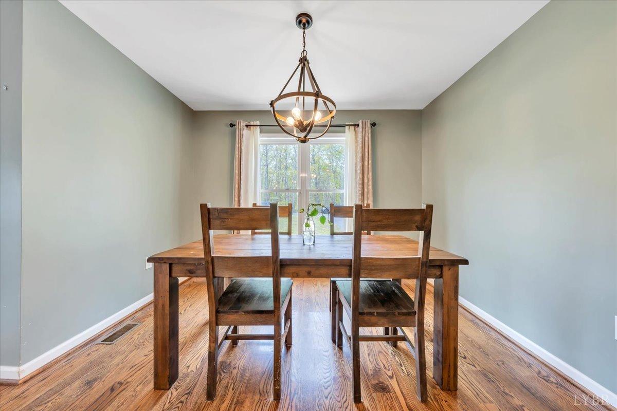 1400 Mountain Cut Road Appomattox, VA 24522 - Photo 12 of 55 a view of a dining room with furniture window and wooden floor