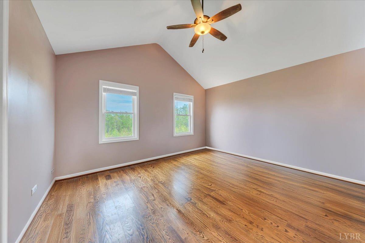 1400 Mountain Cut Road Appomattox, VA 24522 - Photo 14 of 55 an empty room with wooden floor fan and windows