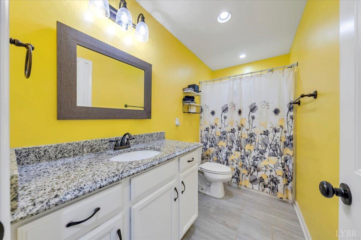 1400 Mountain Cut Road Appomattox, VA 24522 - Photo 20 of 55 a bathroom with a granite countertop sink and a mirror