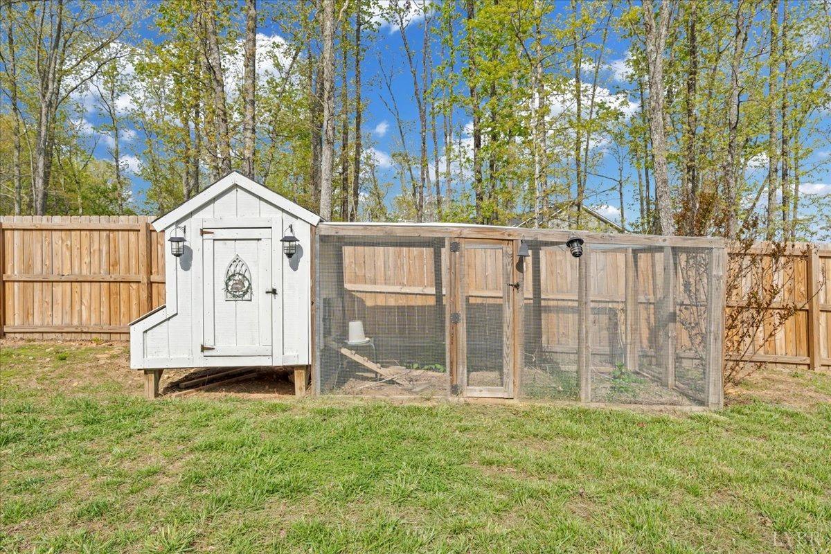 1400 Mountain Cut Road Appomattox, VA 24522 - Photo 27 of 55 a view of a backyard with a garden and deck
