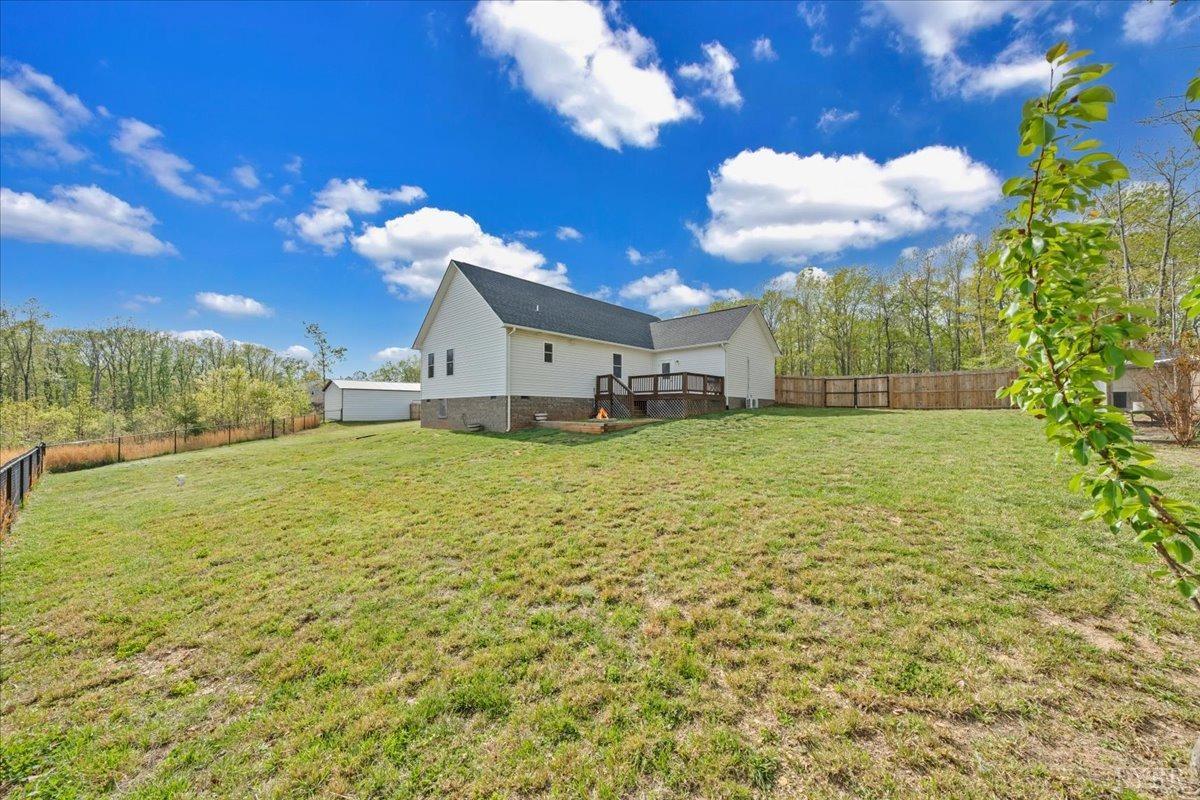 1400 Mountain Cut Road Appomattox, VA 24522 - Photo 30 of 55 a view of a big yard with flower plants and large tree